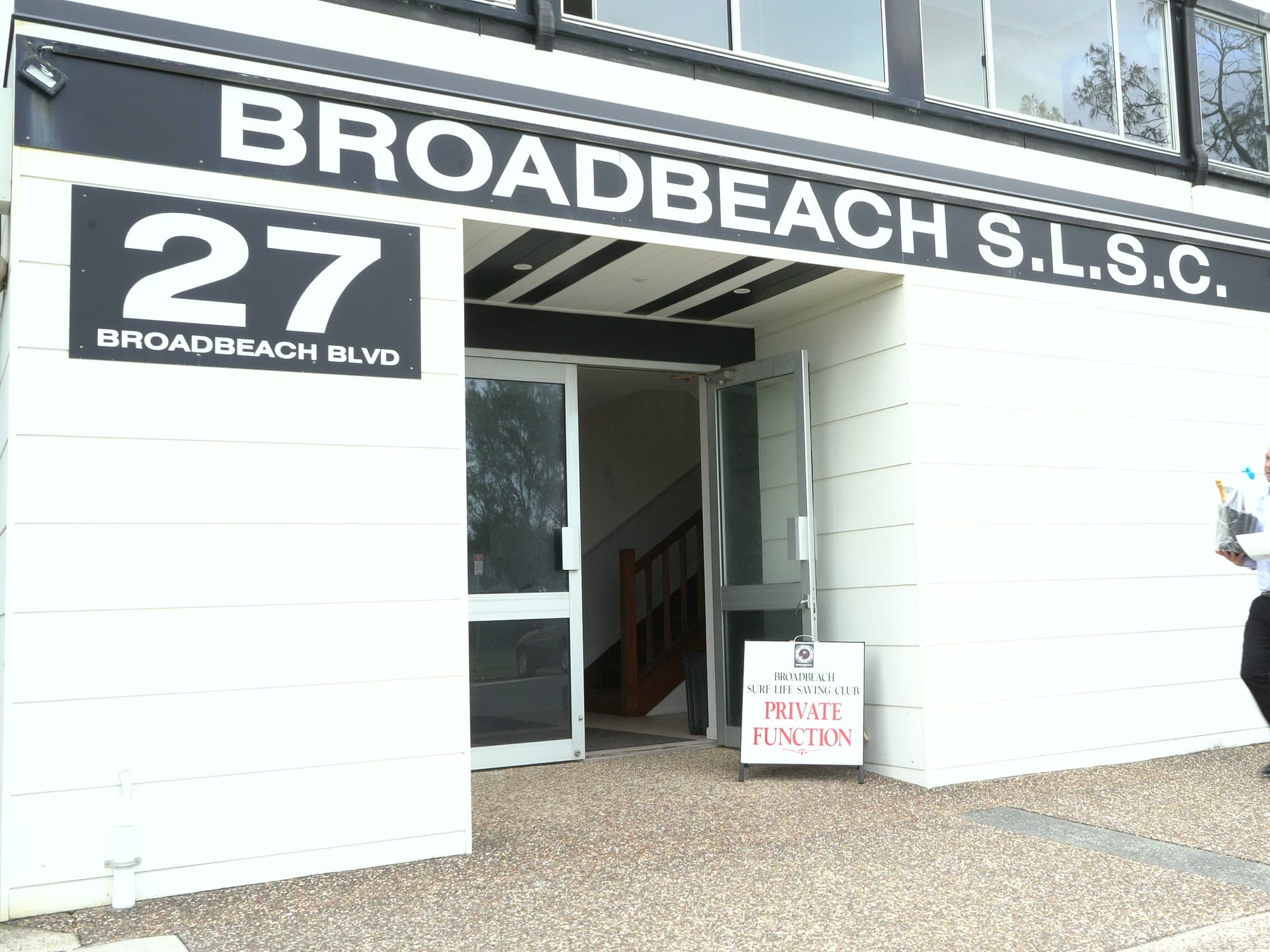 The entrance to Broadbeach Surf Life Saving Club on the day, with a private function sign out front.